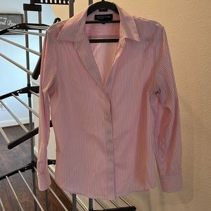 Pink and white striped button up blouse. It’s a non iron shirt. Flattering cut.